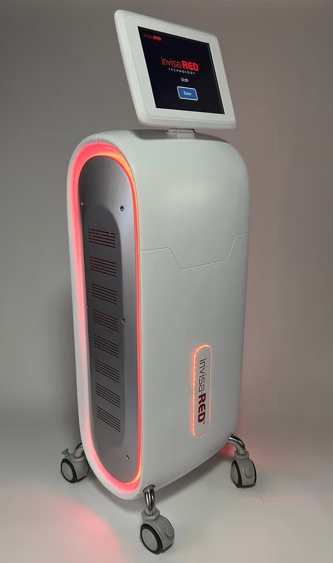 The invisa-RED unit: a wheeled white machine with a tall oval light panel glowing red, and a touchscreen mounted on top
